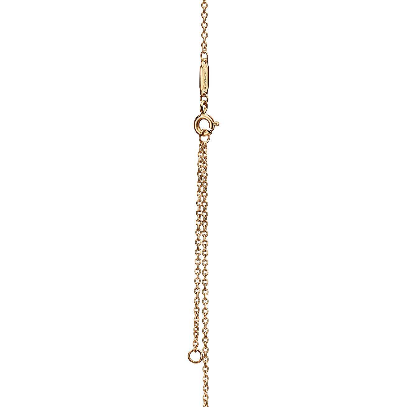 TIFFANY KNOT PENDANT IN YELLOW GOLD WITH DIAMONDS