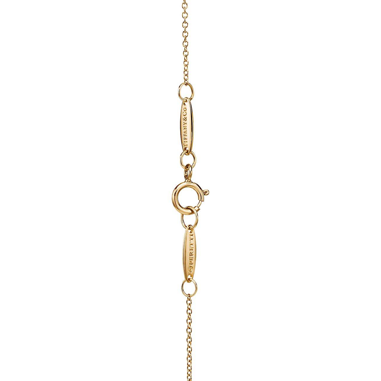 TIFFANY ELSA PERETTI® BEAN® DESIGN PENDANT IN YELLOW GOLD WITH PAVÉ DIAMONDS, 6.5 MM