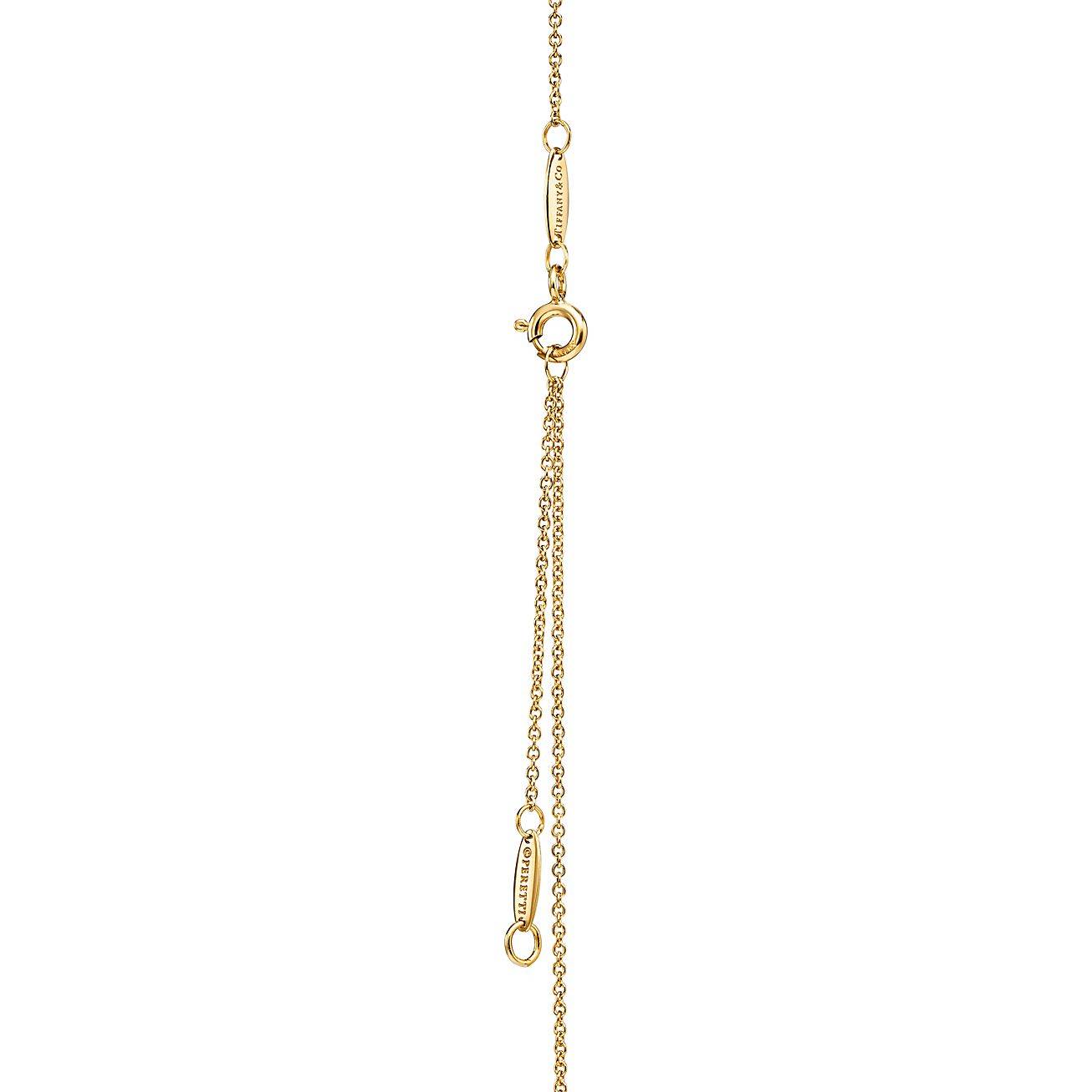 TIFFANY ELSA PERETTI® BEAN® DESIGN PENDANT IN YELLOW GOLD WITH PAVÉ DIAMONDS, 12 MM